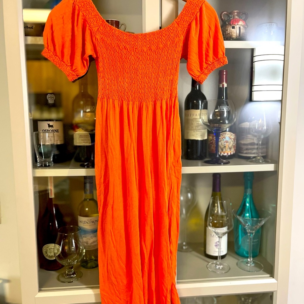 SOLD.   Bebe Orange dress